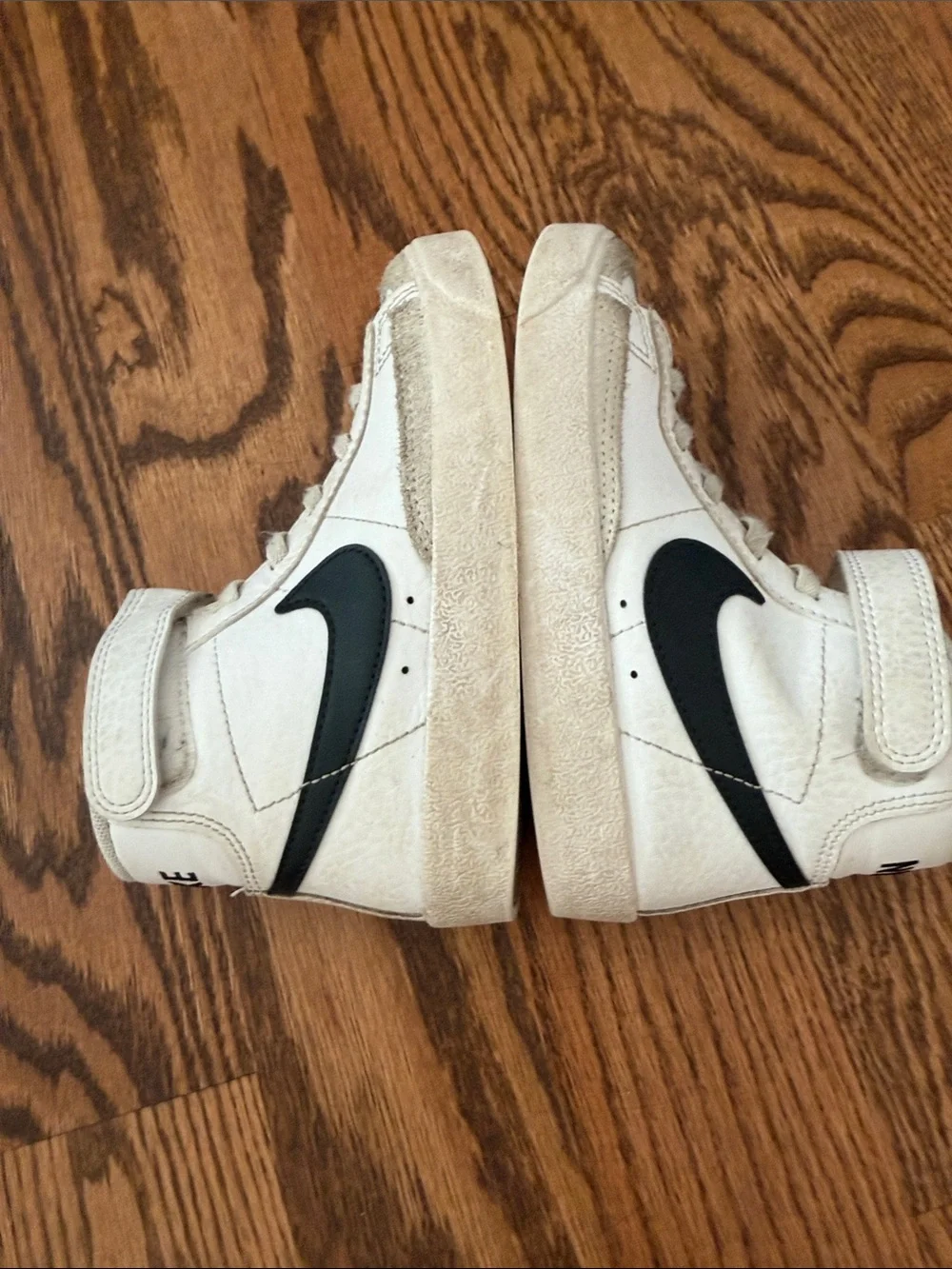 Nike Kids High-Top Sneakers in White with Black Swoosh